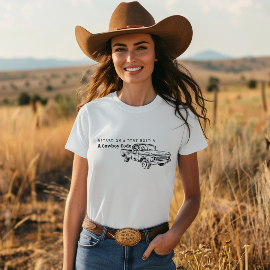 Raised on a Dirt Road and a Cowboy Code Unisex Tee